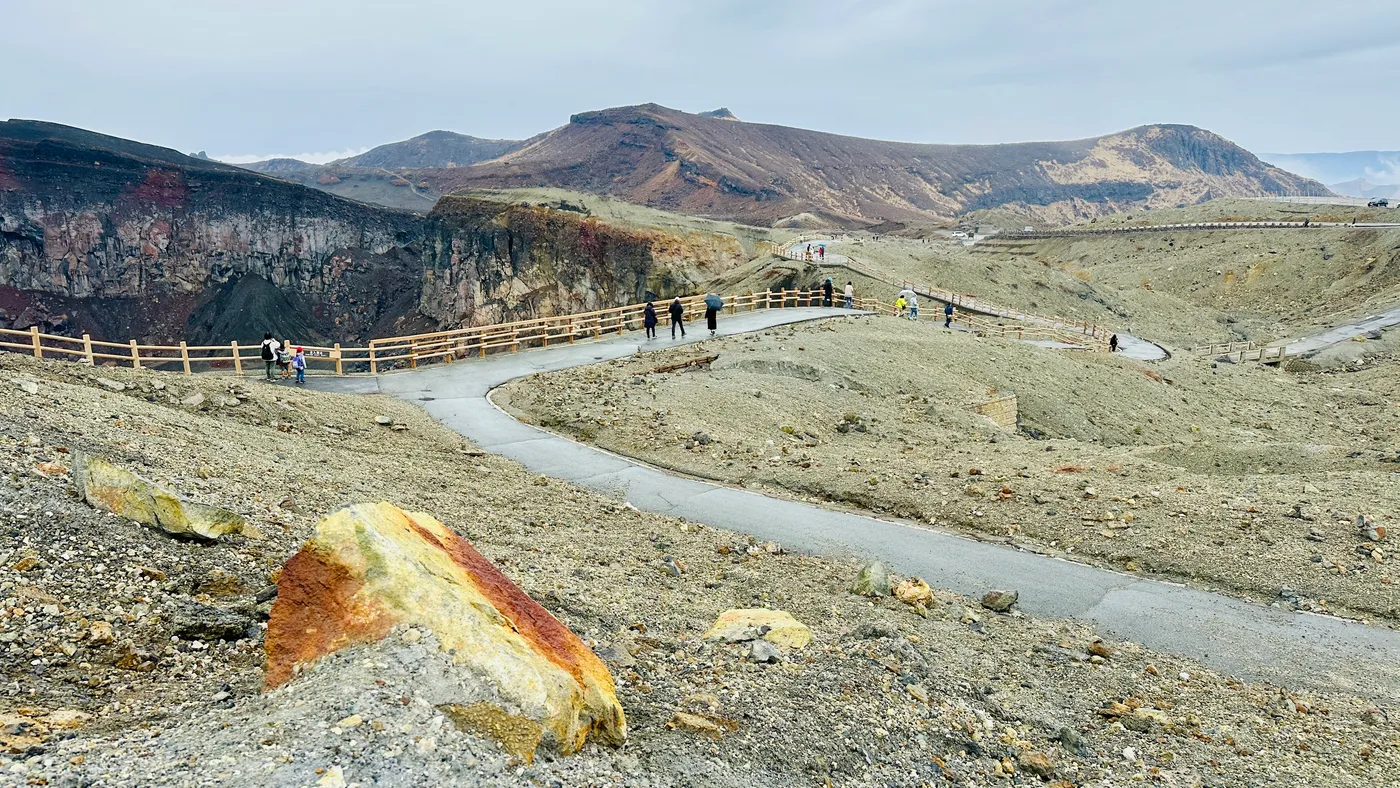 Walking the volcanic crater path at Mount Aso